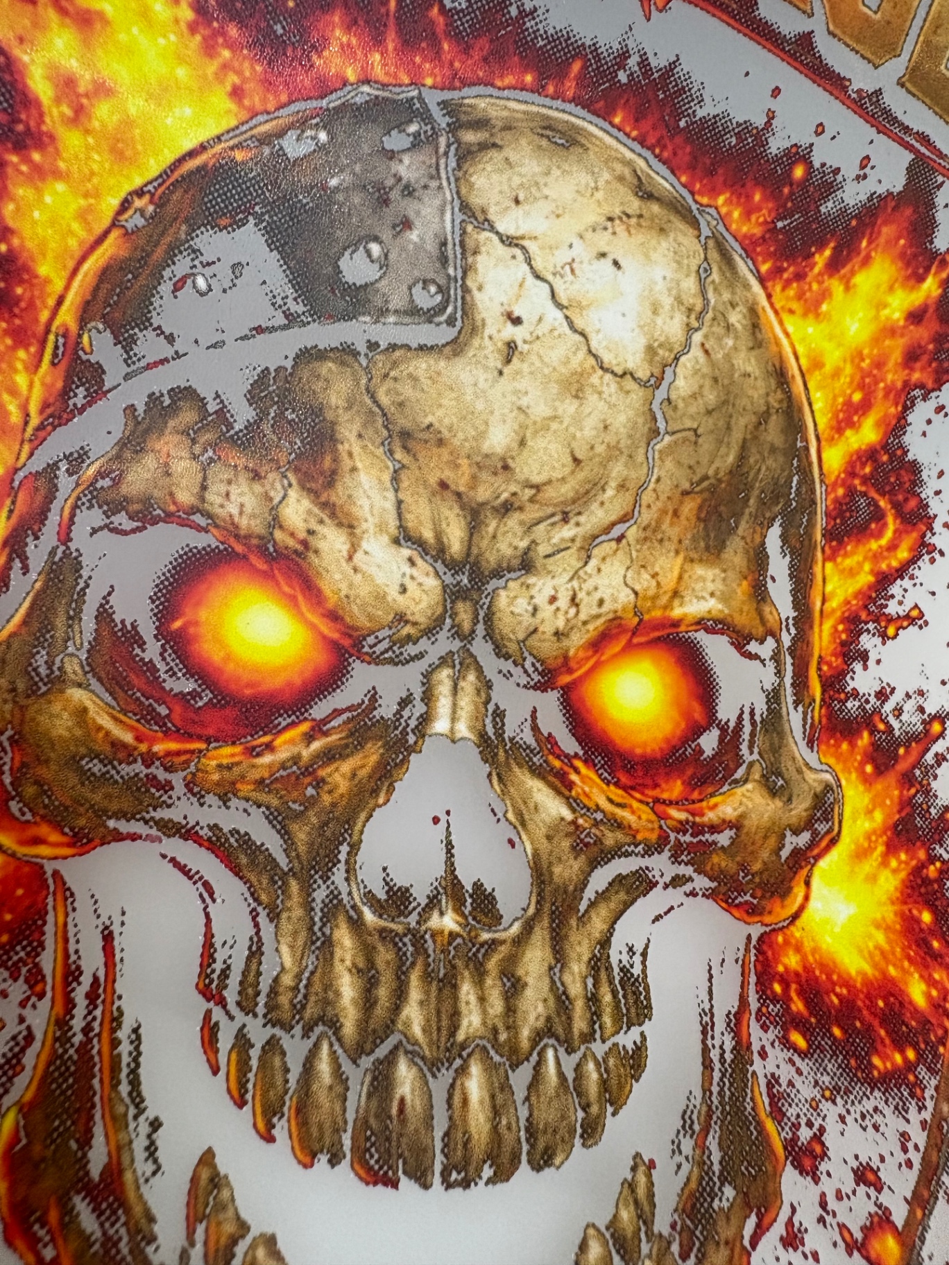 Flaming skull DTF transfer prepared for a black garment, with black areas knocked out